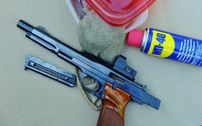 process of cleaning a gun with WD40